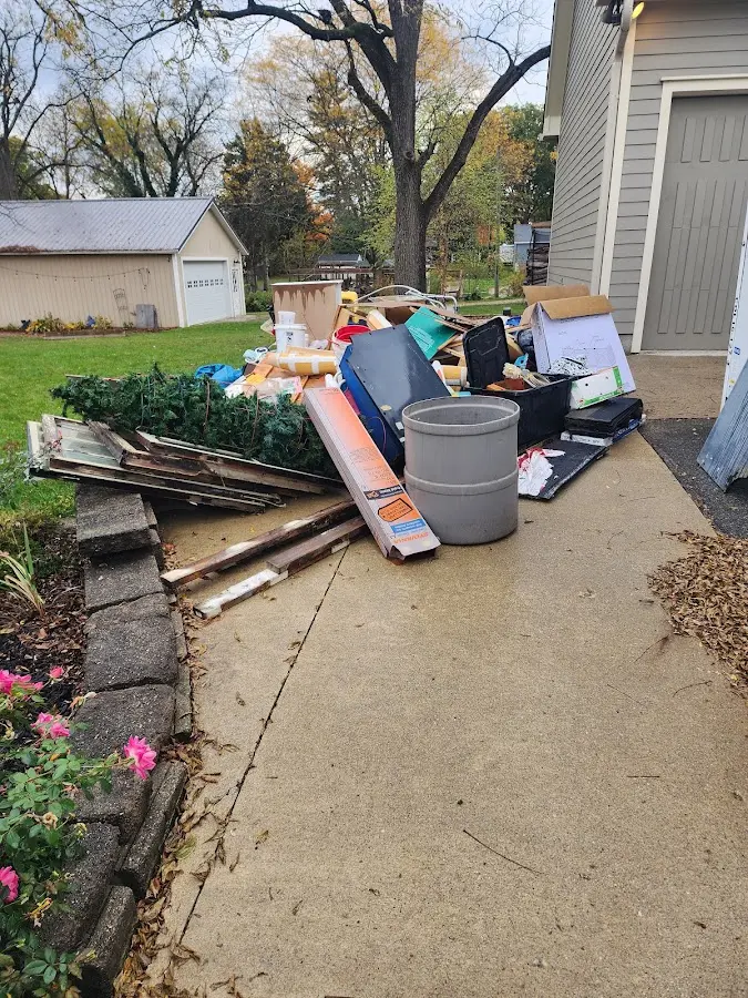 Dumpster being loaded with debris for Commercial Dumpster Rental in Christiana